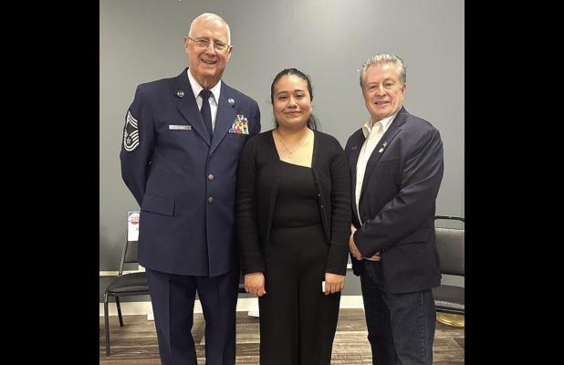 Gibbon’s Jacqueline Ramirez (center), overall winner in the America 250 Essay Contest, is flanked by CMSGT John Stewart on her left and Nebraska State Senator Stan Clouse during the awards ceremony on May 2. (–courtesy photo)
