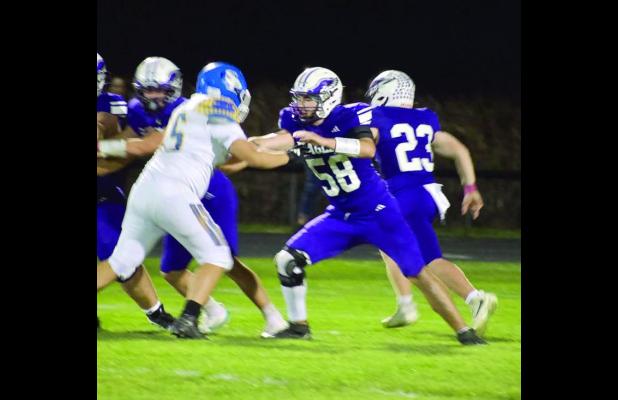 Senior lineman sets up blocking protection against St. Paul in last Friday night’s contest. (—photo by Andrea Johnson)
