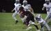 Graeson Swarm tackles an Arcadia/Loup City ball carrier as teammates move in to assists during the Buffaloes’ eight point win last Friday night. (—photo by Alissa Baxter)