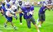 Eagle running back Gavyn Johnson stiff arms his way around a Lincoln Lutheran tackler. (—photo by Andrea Johnson)