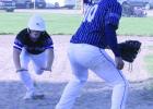 Shelton/Gibbon third baseman Adan Tamayo waits for a throw as Wood River baserunner Briggs Doane dives into the base. Doane was safe on the play.