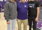 Darin Waddington, in the center, is joined by his sons Evan at left and Riley at right, at a wrestling tournament this past winter. (—courtesy photo) Darin Waddington, in the center, is joined by his sons Evan at left and Riley at right, at a wrestling tournament this past winter. (—courtesy photo)