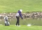 Jeremy Fehringer makes a splash on the wet greens at the district meet last week at Southern Hills Golf Course after the area received enough rain to make the course a squishy challenge to play on. (–courtesy photo)