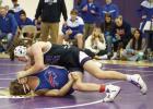 Sawyer Thompson gets a takedown and works for more back points while competing for the Eagles at their home duals tournament last Saturday. (—photo by Doug Kuskie)