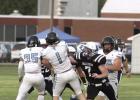 Shelton senior Dominick Larraga anchors the Bulldog defensive line, shown here pressuring the Wilcox/Hildreth quarterback into an incomplete pass.
