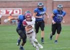 Bryce Gorecki has a host of Bluehawks chasing him during the Centurions 27-7 pasting of Hastings St. Cecilia. (—courtesy photo) Centurion gridders role Bluehawks by twenty