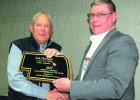 Rob Clevenger, of Gibbon, accepts “Industry Person of the Year” award from Nebraska Agri-Business Association vice chairman Jesse Trotter. (–courtesy photo) Rob Clevenger, of Gibbon, accepts “Industry Person of the Year” award from Nebraska Agri-Business Association vice chairman Jesse Trotter. (–courtesy photo)