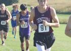 Parker Lauritsen leads a pack of runners on the Ravenna course while competing for the Centurion cross country team. (—photo by Amber Price) Article Image Alt Text