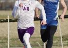 Eagle senior Jace Martin raced to a second place finish in the 400 meter dash, and a fourth place spot in the 200 meter dash to pace the boys to the team title at their home meet last week. (—photo by Andrea Johnson)