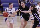 Gibbon’s Karsyn Grimes tries to pass the basketball under the pressure of Shelton’s Erin Gegg and Susie Cheney during the game last Tuesday, January 6. (—photo by Steve Glenn) Gibbon’s Karsyn Grimes tries to pass the basketball under the pressure of Shelton’s Erin Gegg and Susie Cheney during the game last Tuesday, January 6. (—photo by Steve Glenn)