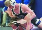 Eagle senior Jace Martin works a power half on his opponent during the Wood River Invite last Friday. Jace won all four of his matches at the meet, including a pin in the championship match to claim the title in the 120 pound weight class. (—photo by An Eagle senior Jace Martin works a power half on his opponent during the Wood River Invite last Friday. Jace won all four of his matches at the meet, including a pin in the championship match to claim the title in the 120 pound weight class. (—photo by An