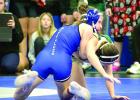 Ila Jurgens gets leverage and another win on her way to capturing the conference title in the 105 pound weight class at Ravenna on Saturday. (—photo by Andrea Johnson) Ila Jurgens gets leverage and another win on her way to capturing the conference title in the 105 pound weight class at Ravenna on Saturday. (—photo by Andrea Johnson)