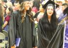 Gibbon graduates Lynsey Weekley (left) and Destiny Nunez display a mix of happiness and surprise as their time at Gibbon High School ends as they leave the gym for the final time after commencement ceremonies concluded. (–photo by Steve Glenn) Gibbon 2022 commencement held Saturday