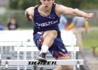 Shelton’s Kyson Gilliland competed in the hurdles for the Bulldogs at last week’s district meet in Fullerton. (–photo by Jeanette Branson) Shelton girls to carry on baton exchange at state