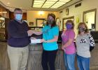 Jim Rennau, left, of the Heritage Group in Wood River, recently presented a $682.50 donation for the Wood River Ministerial Association’s Food Pantry/Backpack Program to, left to right, Nancy DeVore, Pat Lammers, and Lisa Rathman, (–courtesy photo) WRMA Food Pantry/Backpack Program receives monetary gift from Heritage Group