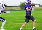 Jaxson Scellin hauls in a pass during Friday night’s showdown with Lincoln Lutheran on the Eagles’ home field. (—photo by Andrea Johnson)