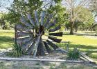 A decorative windmill sits near the new playground equipment at Windmill State Park south of Gibbon. (—photo by Steve Glenn)