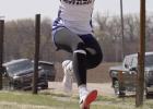 Brynn Baxter stretches during one of her triple jump phases while competing at the Franklin Invite last week. (—photo by Alissa Baxter)