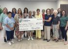 Legacy Station representatives and Wood River residents who frequent the Wood River Senior Center located within the Legacy Station were on hand for the grant presentation recently held at the Legacy Station in Wood River to accept the check from Greater 