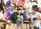 A member of the Gibbon High Class of 2022 doles out a hug as graduates distributed flowers to family members during the graduation exercises last Saturday in Gibbon. (–photo by Steve Glenn) Gibbon 2022 commencement held Saturday
