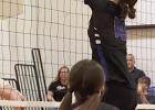 Gibbon’s Cove Fries goes up for a block in recent Lady Buffalo volleyball action. (—photo by Alissa Baxter)