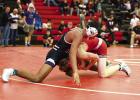 Eagle Hector Bonilla fights off a takedown attempt during conference wrestling action at Ord last Saturday. Hector fought his way to win the 132 pound title for the Eagles. (—photo by Doug Kuskie)