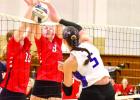 Wood River’s Lainey Paulk pounds a spike into the block with force. (—photo by Andrea Johnson)