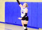 Senior Lacie Frear contacts a serve in recent Lady Eagle volleyball action. (—photo by Andrea Johnson)