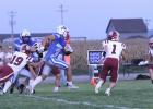 Centura’s Calvin Zimmerman (#19) grabs the jersey of Gibbon’s Isac Tamayo (#3) who cuts loose for a big gain while Centurions Caden Ruhl (#1) and Wyatt Dvorak look to corral the Buffalo runner in last week’s contest. (–photo by Steve Glenn) Article Image Alt Text