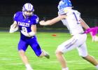 Gavyn Johnson tries to avoid a St. Paul tackler. (—photo by Andrea Johnson)