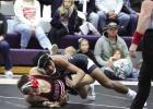 Wood River 126 pounder Hector Bonilla works his way for a pin in the dual against Aurora last Thursday night. (—photo by Steve Glenn) Wood River 126 pounder Hector Bonilla works his way for a pin in the dual against Aurora last Thursday night. (—photo by Steve Glenn)