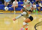 Ellie Morgan prepares to receive a serve during action last week against Minden. (—photo by Steve Glenn) Article Image Alt Text