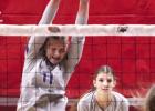Jalyn Branson goes for a block attempt while teammate Erin Gegg awaits a possible dig. (—photo by Steve Glenn) Season ends for Lady Bulldogs at state