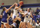 Bulldog senior Erin Gegg goes in for a scoop shot layup on her way to a school record tying 35 points in the win over Kenesaw last Friday night. Erin also surpassed the 1,000 point scoring mark in her Shelton basketball career. (—photo by Jeanette Brans Bulldog senior Erin Gegg goes in for a scoop shot layup on her way to a school record tying 35 points in the win over Kenesaw last Friday night. Erin also surpassed the 1,000 point scoring mark in her Shelton basketball career. (—photo by Jeanette Brans