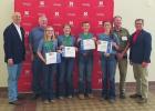 The Buffalo County 4-H Intermediate Livestock Skill-a-Thon team recently earned first place at PASE. Pictured left to right are Governor Pete Ricketts, coach Dean Batie, Laurynn Andrews, Arabella Rolfsmeyer, Graden Forbes, Justine Pope, Nebraska Investmen Article Image Alt Text