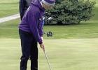 Reece Carter watches his ball roll to the hole while putting during Eagle golf action at Grand Island. (—courtesy photo)