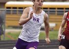 Eagle sprinter Brek Wiese leans into the curve during a heat of the 200 meter dash at the Palmer Invite last week. (—photo by Andrea Johnson)