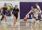 Shelton’s Ellie Morgan and Wood River’s Lainey Paulk go after a loose ball in the girls basketball game last week. Shelton prevailed by the score of 56 to 33. (—photo by Steve Glenn)