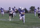 Isac Tamayo dashes past Bluehawks as he returns one of his four interceptions in the Buffaloes’ one-sided win over Hastings St. Cecilia on the field in Gibbon Friday night. (–photo by Dennis Walker) Article Image Alt Text