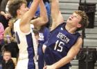 Ben Myers puts up a shot over the outstretched hands of the Kenesaw defender in the Bulldogs’ game last week. Myers led the team with a dozen points. (—photo by Steve Glenn) Ben Myers puts up a shot over the outstretched hands of the Kenesaw defender in the Bulldogs’ game last week. Myers led the team with a dozen points. (—photo by Steve Glenn)