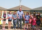 Wood River Mayor Greg Cramer cut the ceremonial ribbon with the help of some young enthusiasts when a ceremony was held for the opening of the Stick Creek Kids Child Development Center. Clipper Year in Review