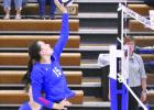 Karsyn Herren tips the ball over to the Centura defenders. (—photo by Steve Glenn) Article Image Alt Text