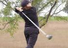 Kasey Ackley follows through and follows the flight of her shot during Lady Buffalo golf action at Ravenna last week. (—courtesy photo)