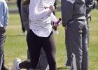 Matilda Green runs a leg on the girls 3200 meter relay team which placed sixth. (—photo by Andrea Johnson)