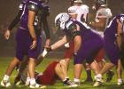 In a physically tough sport, football players show their respect for the battle with an occasional helping hand after the whistle blows. (—photo by Andrea Johnson)