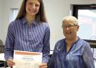 P.E.O. Chapter BI Star Scholarship Chair Cheryl Woodman (right) presents Erin Gegg the $2,500 STAR Scholarship from the P.E.O. Sisterhood. (—courtesy photo)