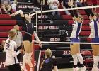 Brynn Baxter fires a spike past two Ravenna defenders during a busy week on the volleyball court for the Lady Buffaloes. (—photo by Alissa Baxter)