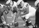 Eagle center Sammy Gonzalez gets the offense started wit the snap of the ball against Boone Central last Friday night. (—photo by Andrea Johnson) Eagle center Sammy Gonzalez gets the offense started wit the snap of the ball against Boone Central last Friday night. (—photo by Andrea Johnson)