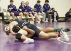 Eagle senior Isaiah Edgren works for a pin in the 190 pound division while leading the Wood River wrestlers on the home mat on Saturday. (—photo by Doug Kuskie)