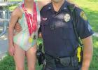 Emmersyn Price poses with Sgt. Jason Hasse, of the Hastings Police Department, in the summer of 2021 when she earned two gold medals in Special Olympics swimming competition. (–courtesy photo) Article Image Alt Text